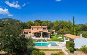 an estate with a swimming pool and a house at Golf Marina in Pollença