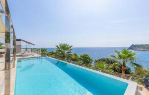 a swimming pool with a view of the ocean at Lifetime in Font de Sa Cala +38 photos