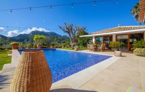 a swimming pool in front of a house at Can Sion in Esporlas