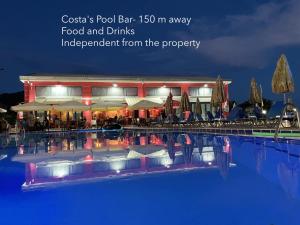 a pool bar away food and drinks independence from the property at Hector's studios in Kalamaki