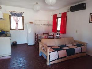 a living room with a bed and a kitchen at CABAÑAS LA PILARICA in San Rafael +35 photos