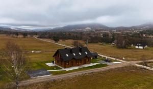 an aerial view of a house in a field at Urocze Wysowa in Wysowa-Zdrój