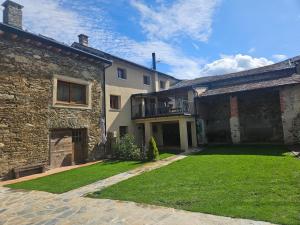a house with a lawn in front of it at Cal Not Celler, Cerdanya in Escardacs