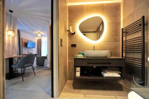 a bathroom with a sink and a mirror at Appartement Chesa Monte in Ischgl +73 photos