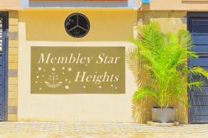 a sign for a kerley star lights on a building at Naivera Membly Star Heights in Ruiru