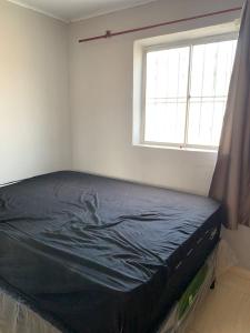 a bed in a room with a window at Edilson santos in João Pessoa +12 photos