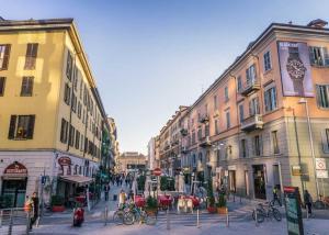 a city street with buildings and people walking on the street at Ecoloft Corso Como Free Private Parking in Milan