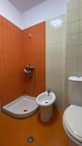 a bathroom with a toilet and a bidet at Sunset Spille in Rrogozhinë