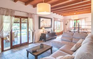 a living room with a couch and a table at Es Sequer in Felanitx