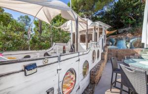 a boat sitting on a patio with a table at Ocean View in Palma de Mallorca +40 photos