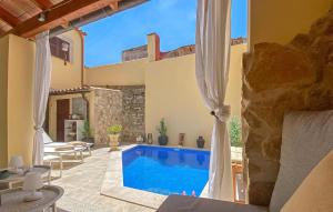 a villa with a swimming pool and a patio at Casa Vida Arta in Artá