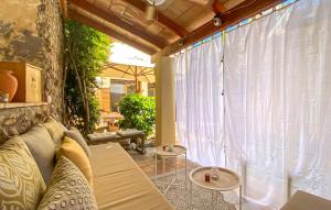 a living room with a couch and a large window at Casa Vida Arta in Artá +23 photos
