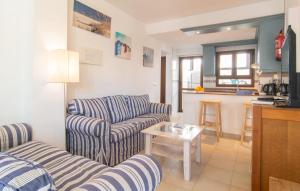 a living room with two couches and a table at Marina D'or Lv Casa 5 in Cala d´Or