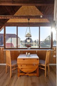 a dining room with a table and two chairs at FY405-Millinge-Assensvej-422 in Faldsled