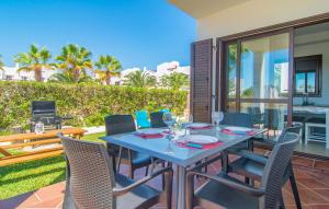 a table and chairs on the patio of a house at Marina D'or Lv Casa 5 in Cala d´Or