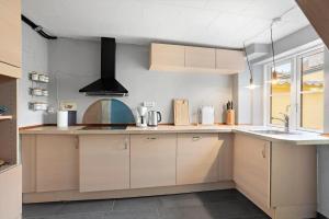 a kitchen with a sink and a stove at FY406-Faaborg-Bojestraede-4-A in Faaborg +16 photos