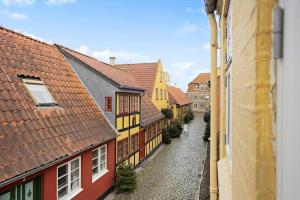 a view of a street with colorful buildings at FY406-Faaborg-Bojestraede-4-A in Faaborg