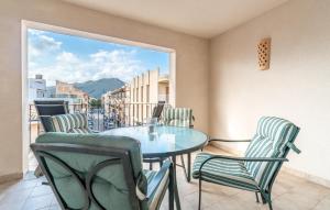 a table and chairs on a balcony with a view at Atico Roger De Flor in Port de Pollensa