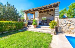 a backyard with a pool and a pergola at Perla Sort Llarga in Moscari +24 photos