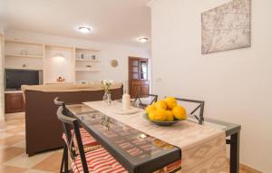 a kitchen with a table with a bowl of fruit on it at Roser De Arta in Artá +26 photos