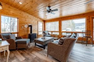 a living room with couches and a fireplace at Arcadia by Railey Vacations in McHenry
