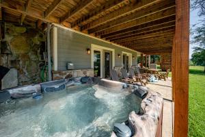 a hot tub on the side of a house at Arcadia by Railey Vacations in McHenry