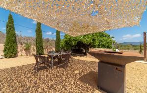 a table and chairs sitting under a large umbrella at Son Cullera Petit in Son Servera +39 photos