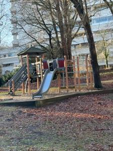 a playground with a slide in a park at BeachPark Sierksdorf in Scharbeutz