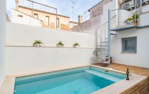 a swimming pool in the backyard of a house at Petit Arta - Sa Botigueta in Artá