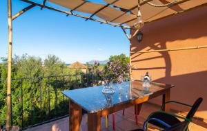 a table with a vase of flowers on a balcony at Estrella De Son Serra in Son Serra de Marina