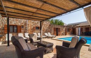 a patio with chairs and a swimming pool at S'hortet in Campos +39 photos