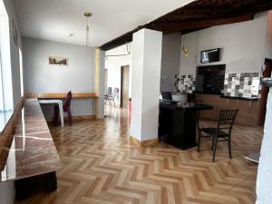 a living room with a kitchen and a dining room at Hotel B&B in Santa Inês