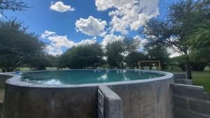 a large pool of water in a park at The Spot at Ghanzi in Khemsbok