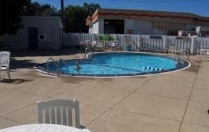 a small swimming pool with a person in it at Home Town Inn in Flint