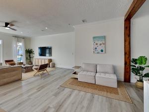 a living room with a couch and a table at Gulf Place Spires #7B - Rum Cake in Santa Rosa Beach