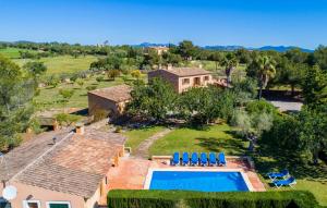 an aerial view of a house with a swimming pool at Can Moleta in Cala Mendia