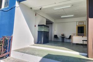 an empty room with a stove in a building at Toucan Garden in Samutprakarn