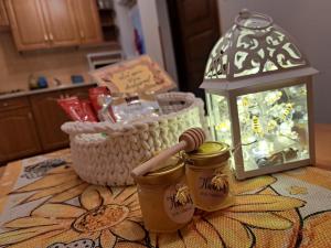 a table with two mason jars and a lantern at Domek Miodu mi daj in Wisła +20 photos