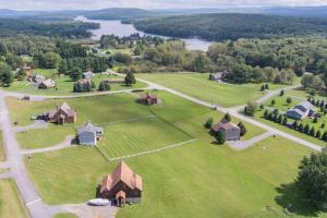an aerial view of a house on a green field at As You Wish by Railey Vacations in Oakland