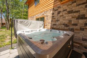 a hot tub in the backyard of a house at Aspen Summit by Railey Vacations in McHenry