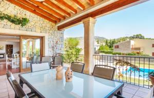 a patio with a table and chairs and a pool at Turixant Dalt in El Port de la Selva