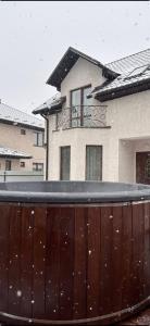 a house with a wooden fence in the snow at Maxim in Vinnytsya +24 photos