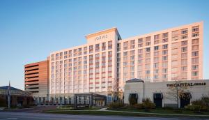 a large building with a hotel on top of it at Loews Chicago O'Hare Hotel in Rosemont