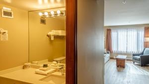 a bathroom with a sink and a mirror at Cahilty #204 home in Sun Peaks