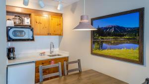 a kitchen with a table and a view of a mountain at Cahilty #204 home in Sun Peaks