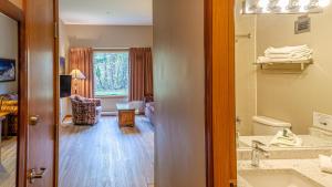 a bathroom with a sink and a toilet in a room at Cahilty #103 in Sun Peaks +6 photos