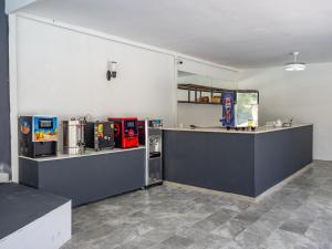 a kitchen with a counter with machines on it at Pera Aura Resort Hotel & Spa - All Inclusive in Kemer