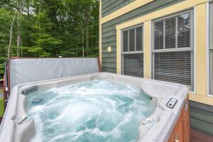 a hot tub on the back of a house at Bear Foot by Railey Vacations in Oakland