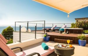 a balcony with a view of the ocean at Robert Christopher Börner in Badia Gran