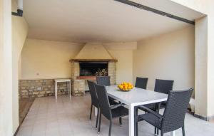 a dining room with a white table and chairs at Es Ganxo House in Porto Cristo +39 photos